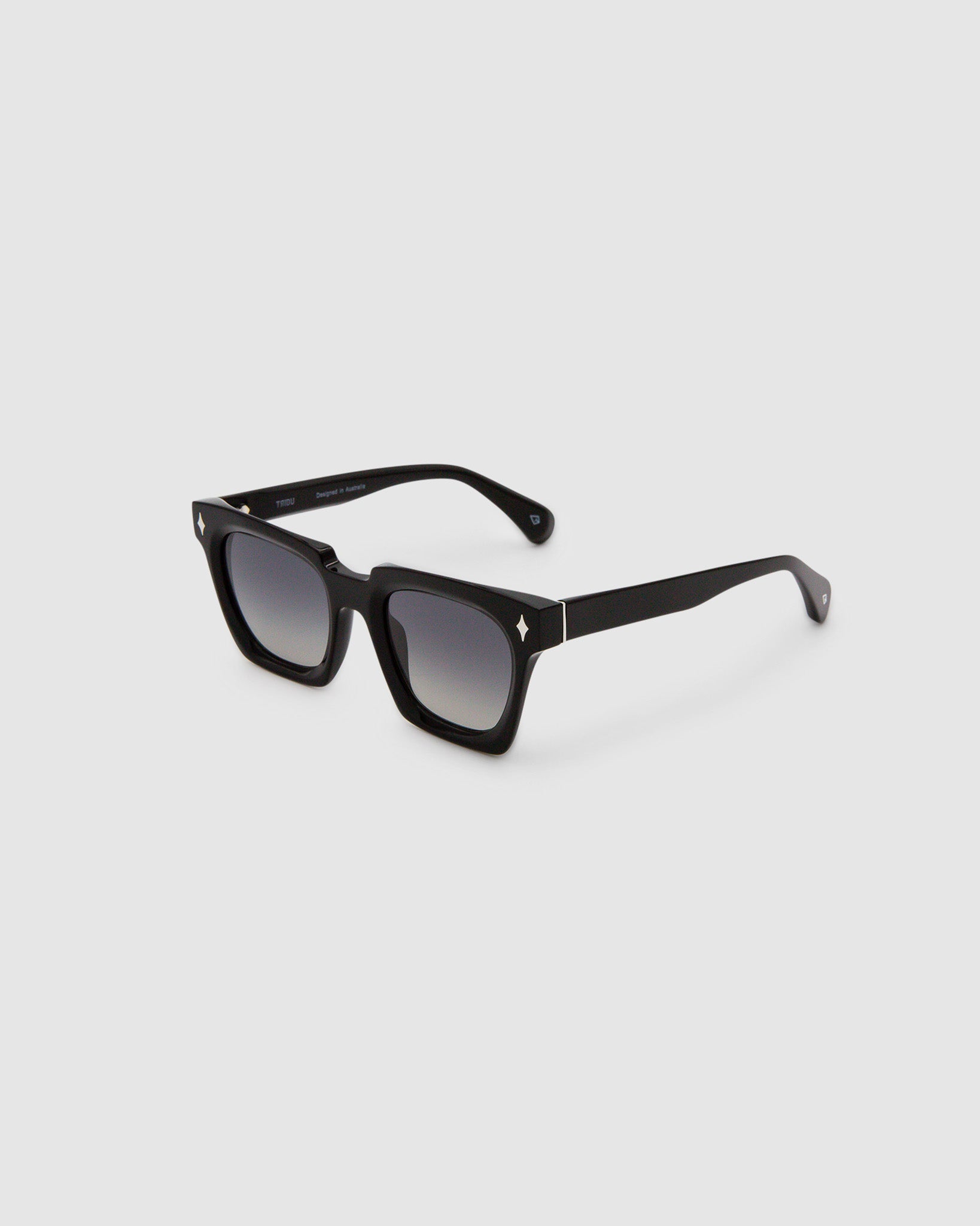 Brutal 1.0 Sunglasses by Tribu Eyewear — Black acetate square frame, grey gradient polarised detailed side view on grey background.
