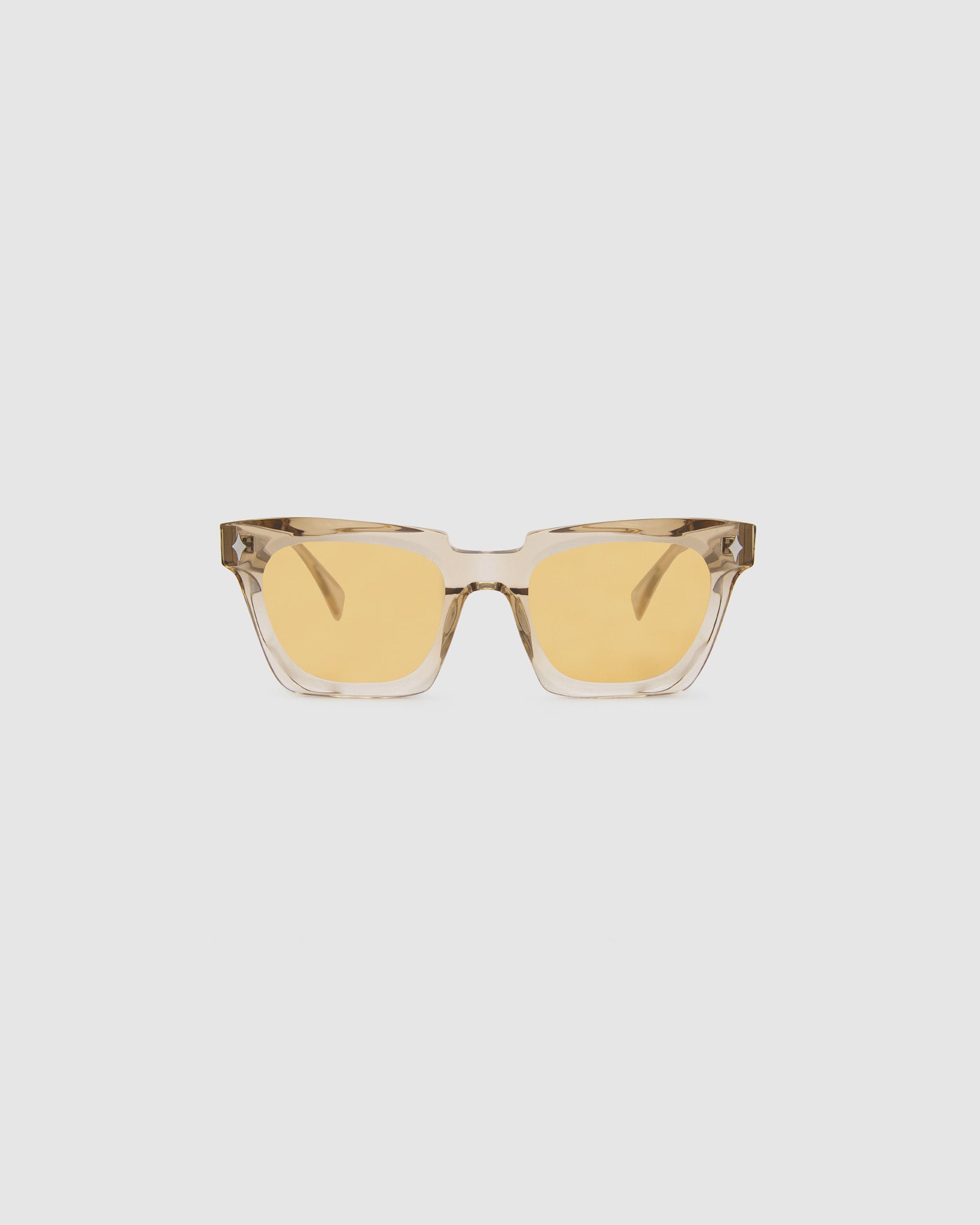 Brutal 1.0 Sunglasses by Tribu Eyewear — Champagne crystal acetate square frame, desert orange tint lens, front view, grey background.