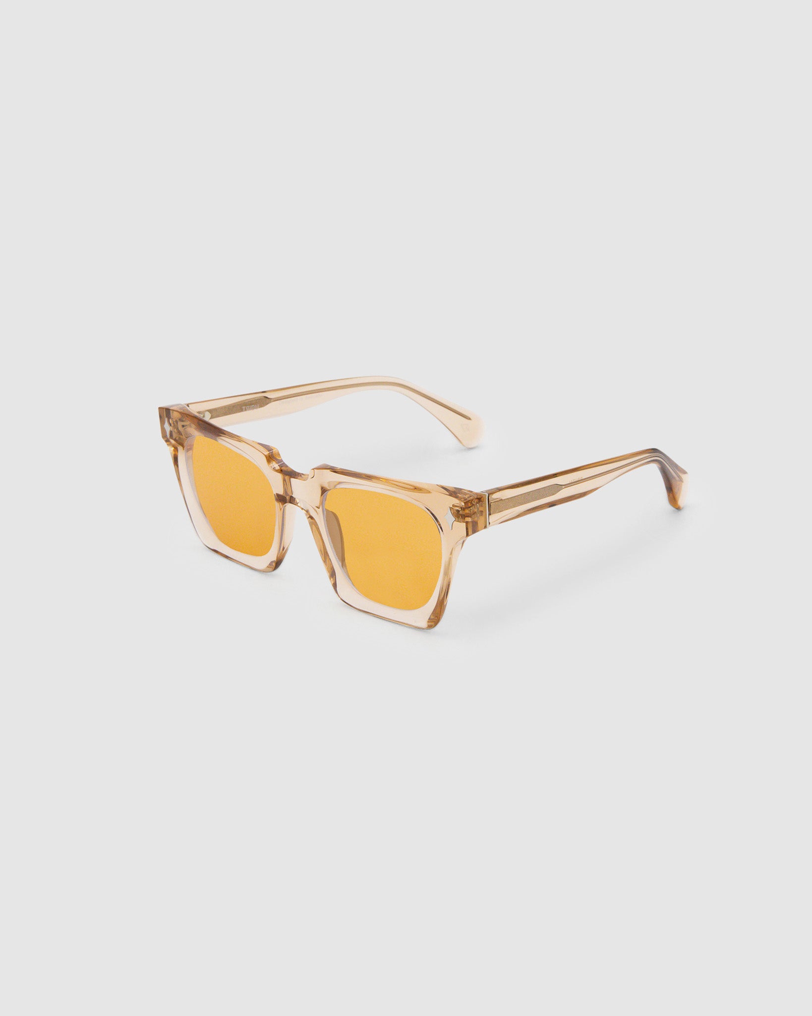 Brutal 1.0 Sunglasses by Tribu Eyewear — Champagne crystal acetate square frame, desert orange tint lens, detailed side view, grey background.