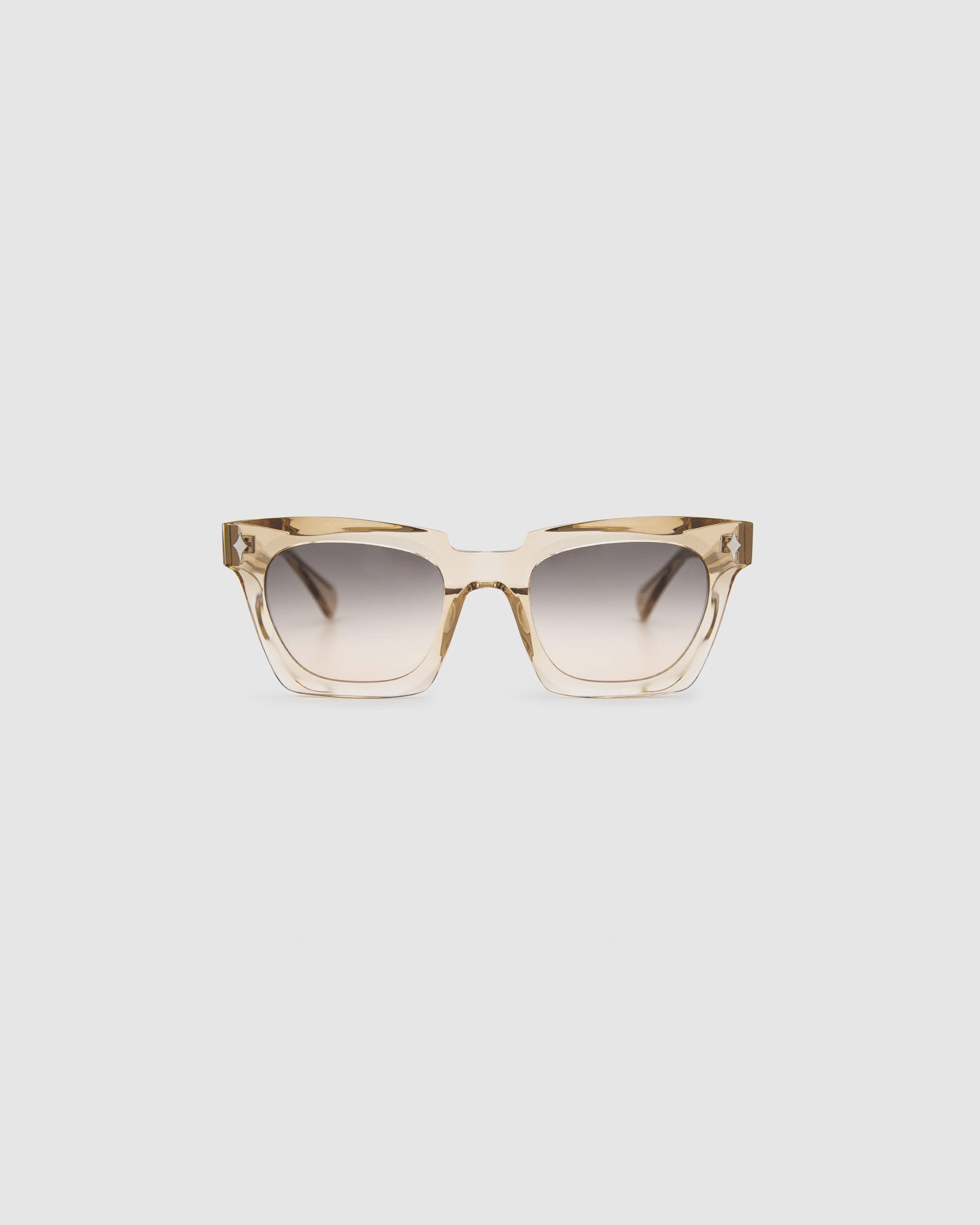 Brutal 1.0 Sunglasses by Tribu Eyewear — Champagne crystal acetate square frame, dusk tint lens, front view, grey background.