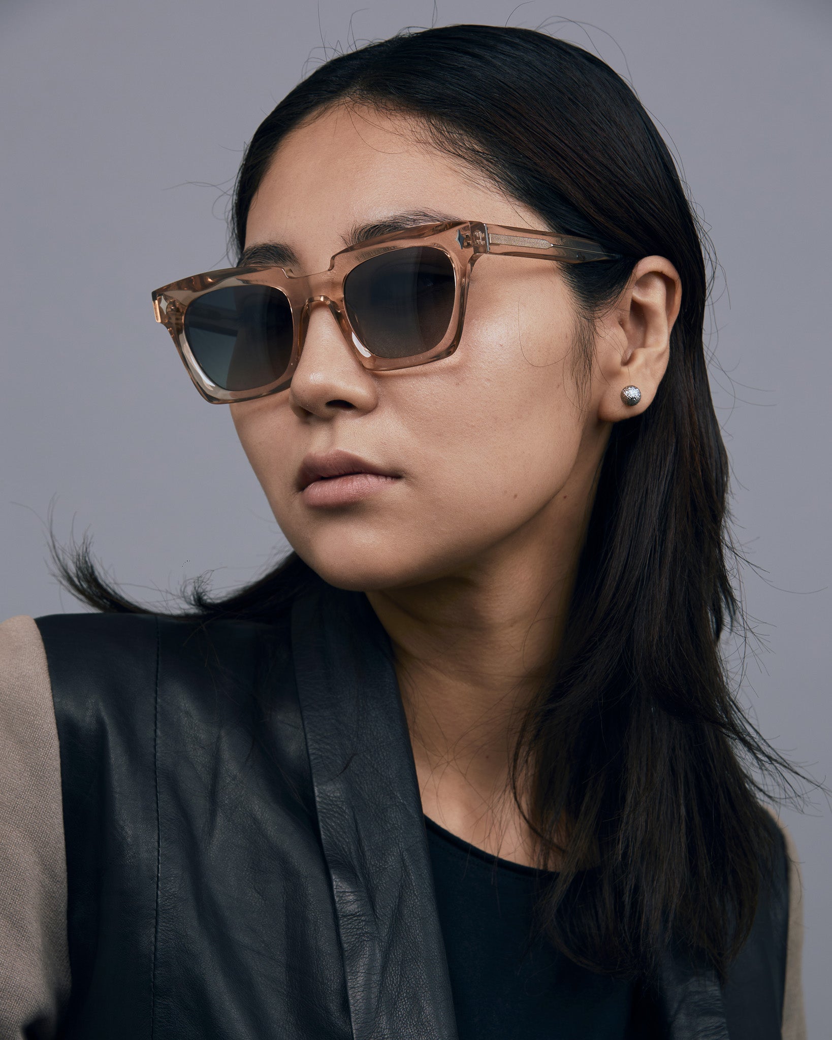 Brutal 1.0 Sunglasses by Tribu Eyewear — Champagne crystal acetate square frame, grey gradient polarised, female model.