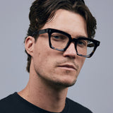 Brutal 1.0 Optical by Tribu Eyewear — Tortoiseshell square optical frame, male model in studio lighting. 