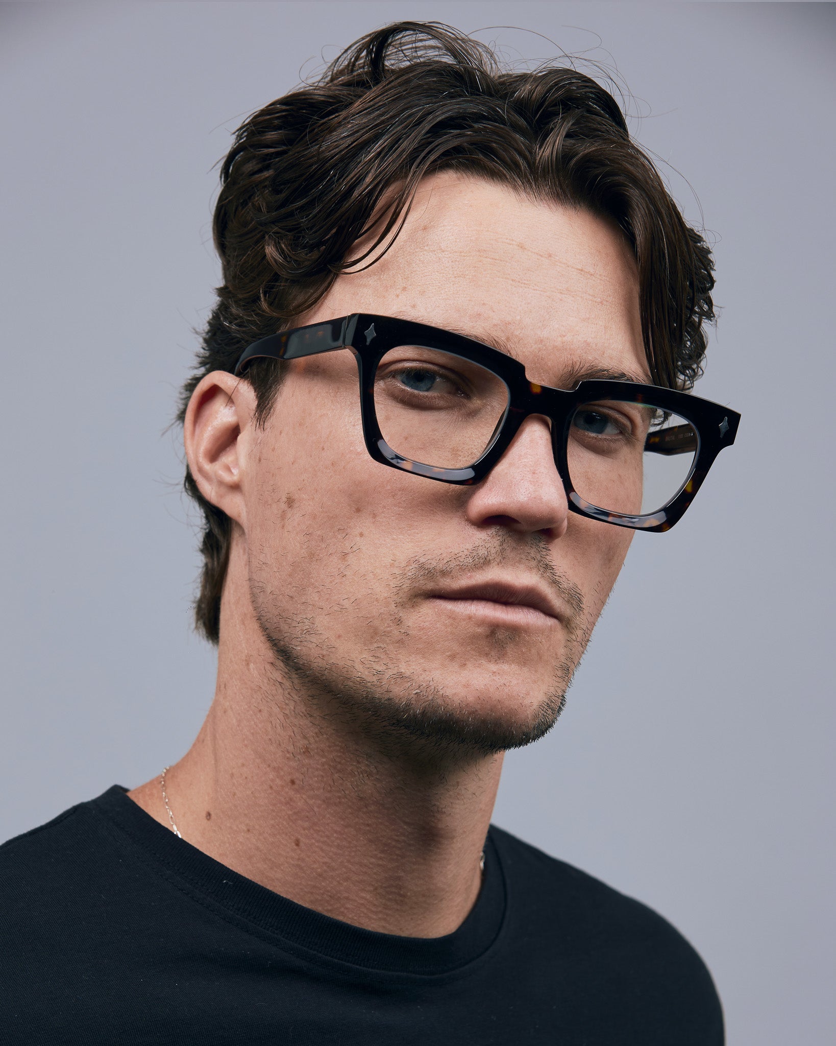 Brutal 1.0 Optical by Tribu Eyewear — Tortoiseshell square optical frame, male model in studio lighting. 