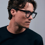 Brutal 1.0 Optical by Tribu Eyewear — Tortoiseshell square optical frame, male model side view in studio lighting. 