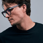 Brutal 1.0 Optical by Tribu Eyewear — Tortoiseshell square optical frame, male model side view in studio lighting. 