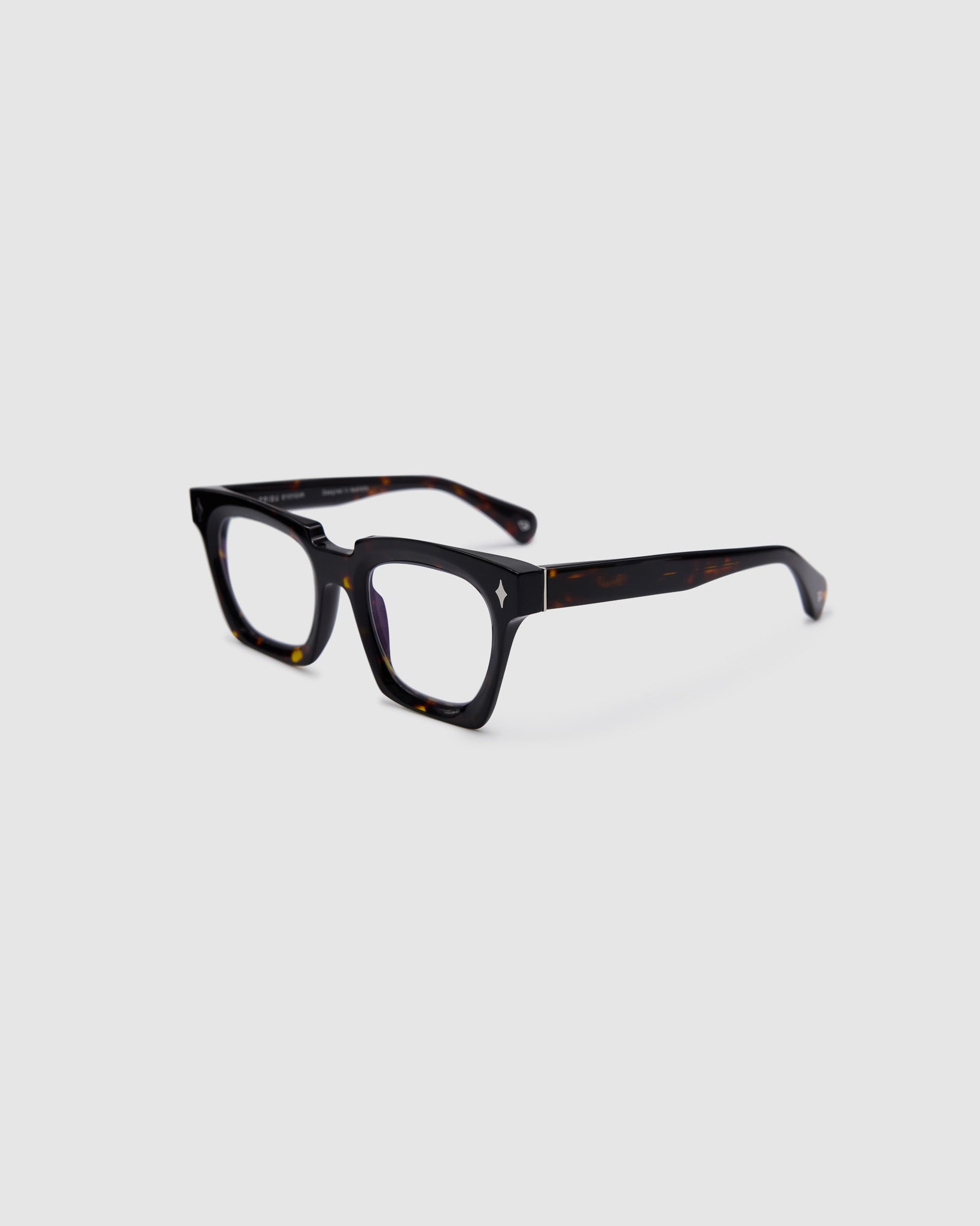 Brutal 1.0 Optical by Tribu Eyewear — Tortoiseshell square optical frame, side view studio lighting. 