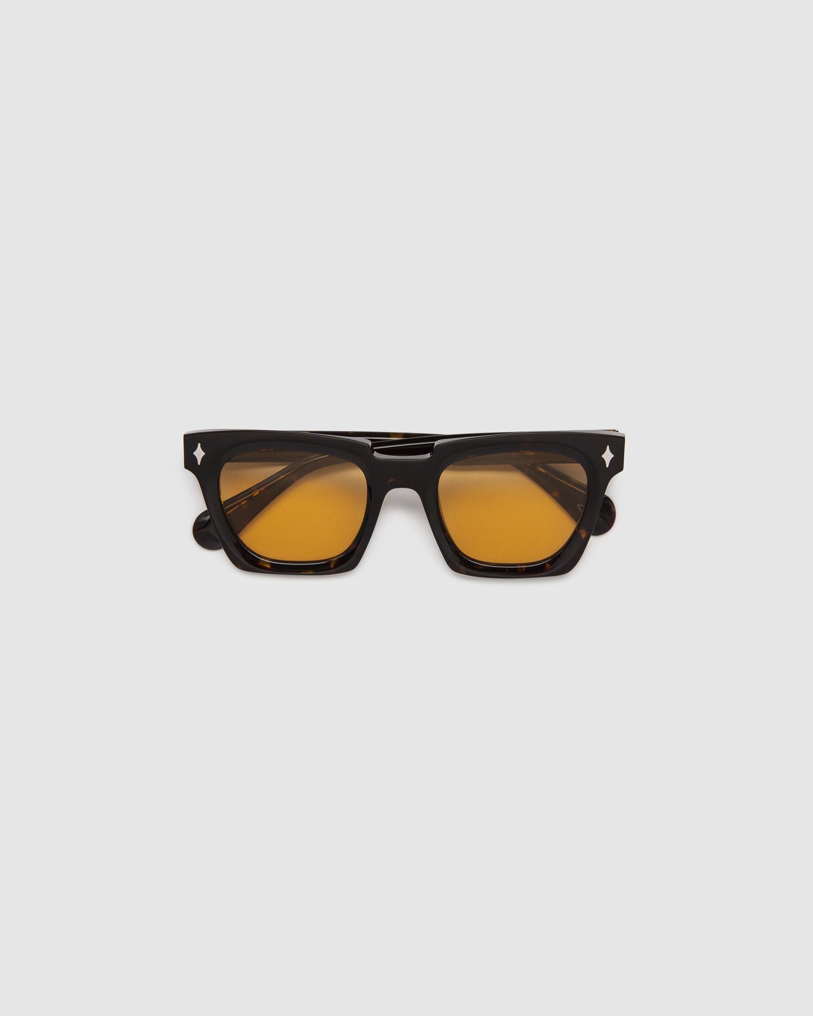 Brutal 1.0 Sunglasses by Tribu Eyewear — Tort acetate square frame, desert orange  lens, flat view, grey background.
