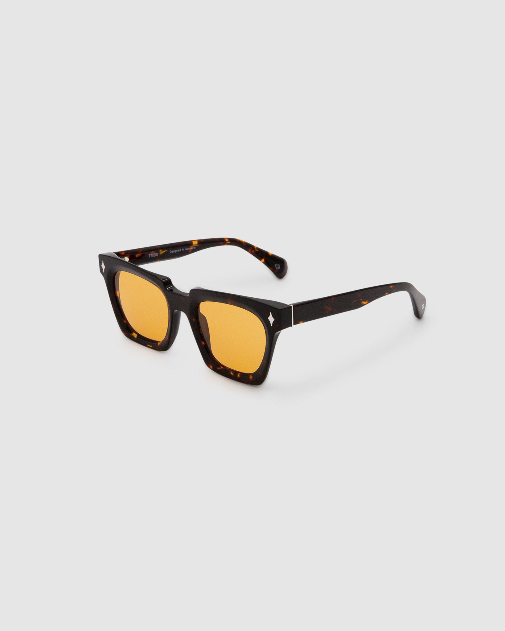 Brutal 1.0 Sunglasses by Tribu Eyewear — Tort acetate square frame, desert orange  lens, side view, grey background.