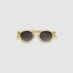 Brutal 2.0 Sunglasses by Tribu Eyewear — Grey grad polarised lens in a Champagne crystal round acetate frame, flat view on grey background.
