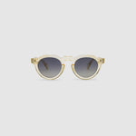 Brutal 2.0 Sunglasses by Tribu Eyewear — Grey grad polarised lens in a Champagne crystal round acetate frame, front view on grey background.