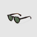 Brutal 2.0 Sunglasses by Tribu Eyewear — Green polarised lens in a round tort acetate frame, side view on grey background.