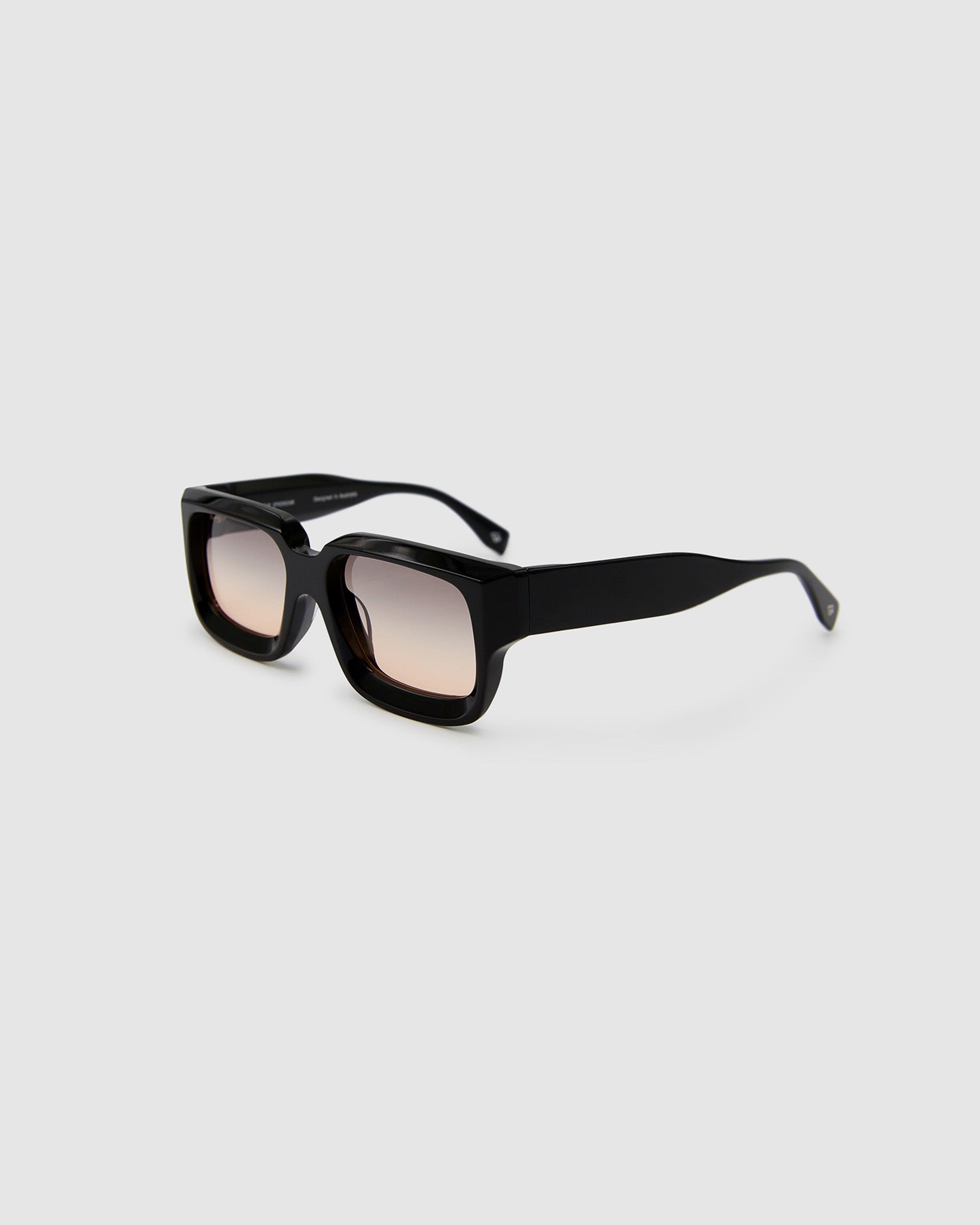 Brutal 3.0  Sunglasses by Tribu Eyewear — Black square acetate frame, dusk lens, side view light grey background.