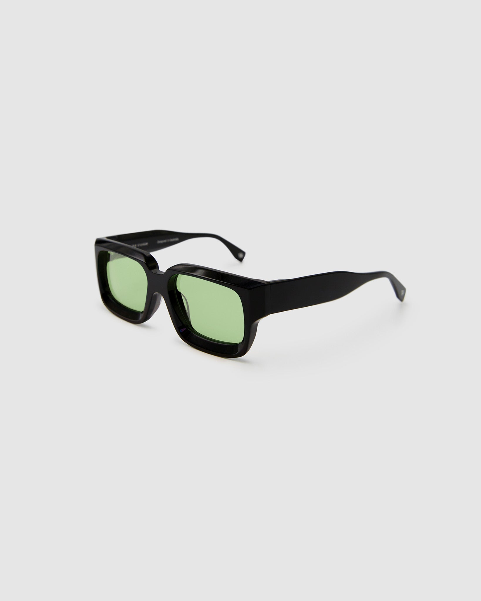 Brutal 3.0  Sunglasses by Tribu Eyewear — Black square acetate frame, sage lens, side view light grey background.