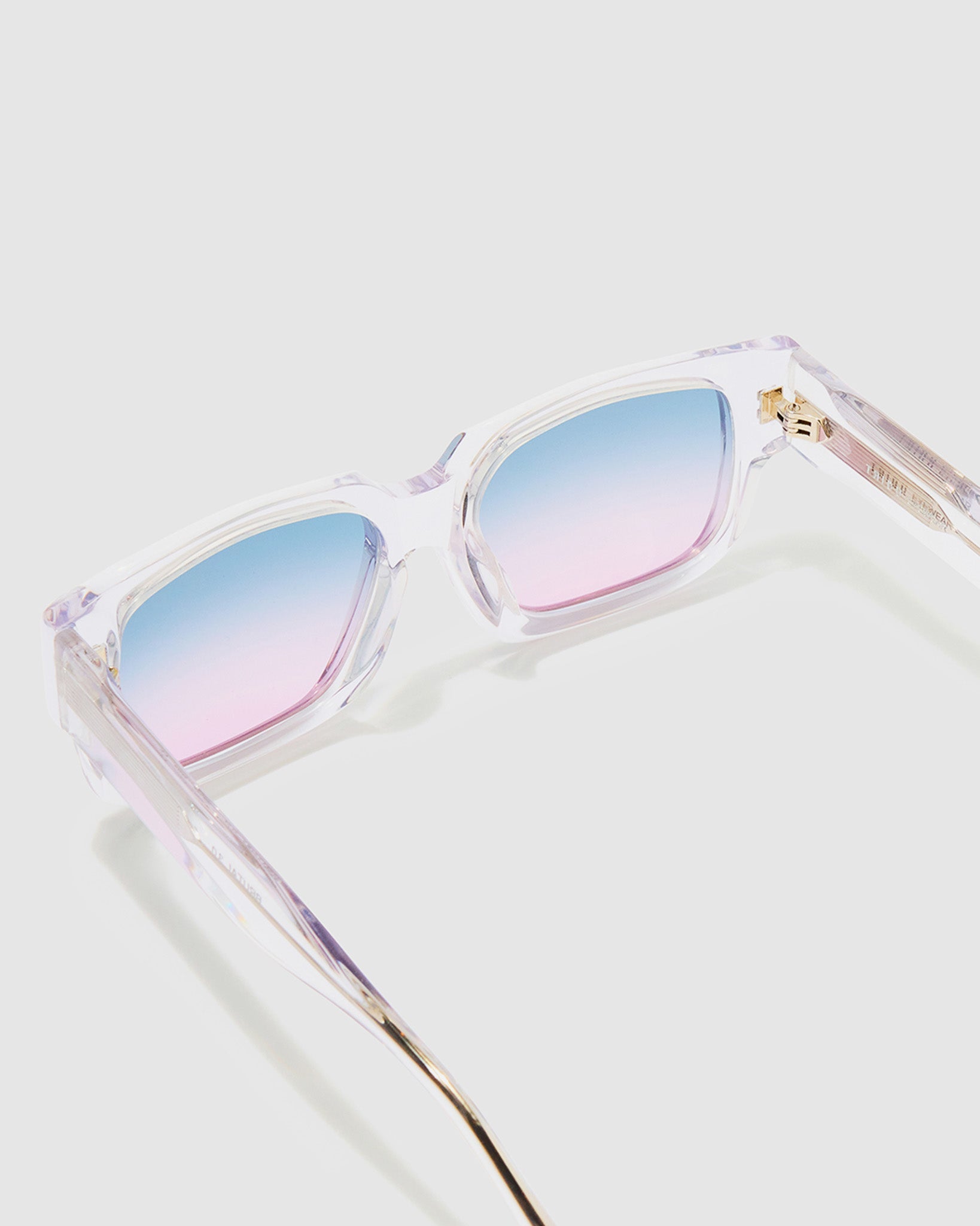 Brutal 3.0 Crystal Sunglasses by Tribu Eyewear — Crystal square acetate frame, Deep Ocean lens, detailed view light grey background.
