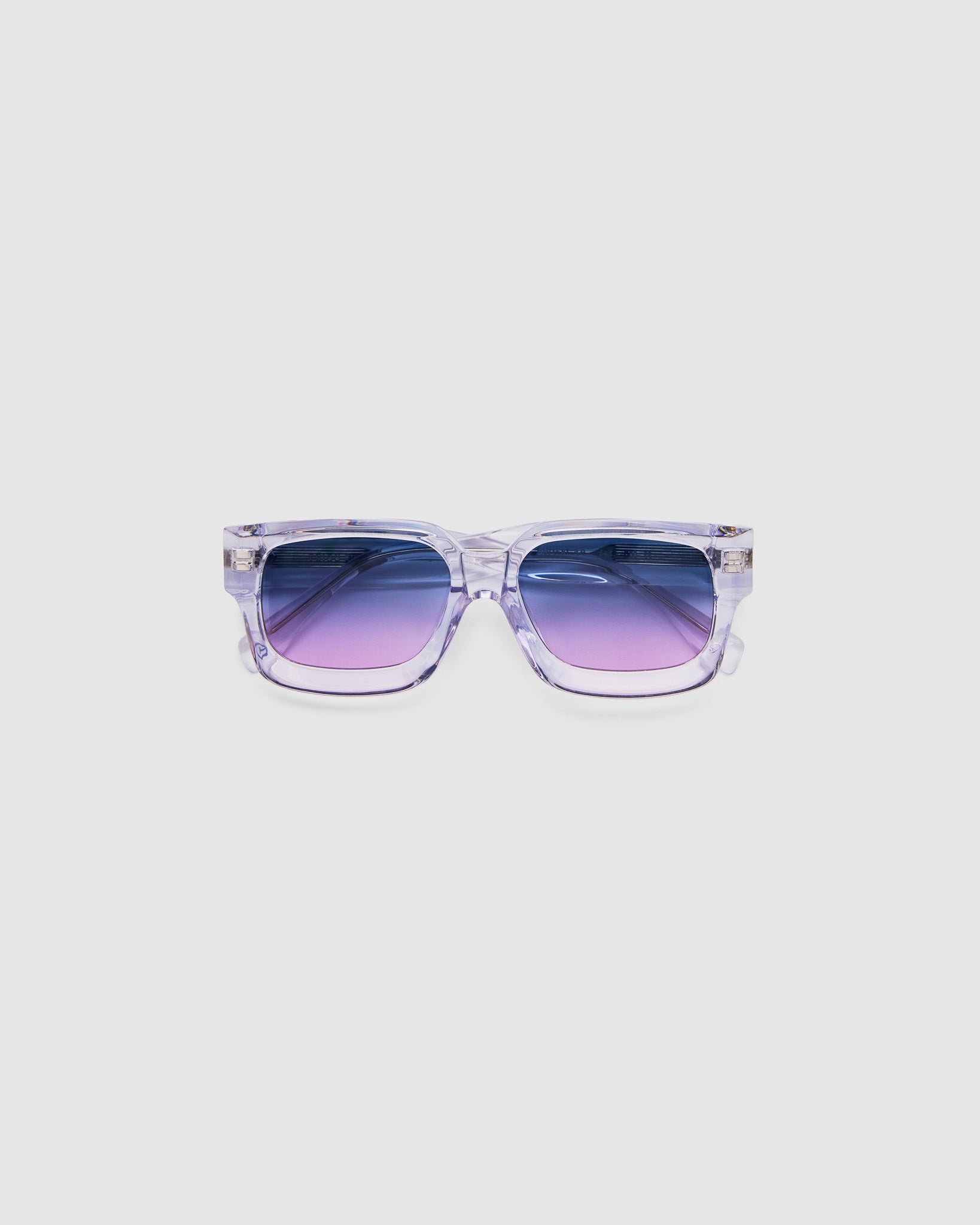 Brutal 3.0 Crystal Sunglasses by Tribu Eyewear — Crystal square acetate frame, Deep Ocean lens, flat view light grey background.