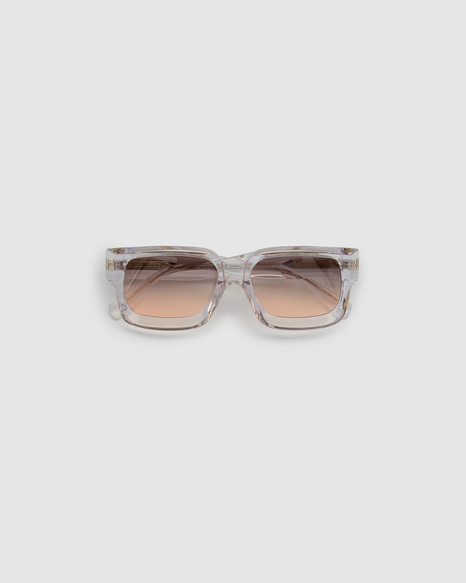Brutal 3.0  Sunglasses by Tribu Eyewear — Crystal square acetate frame, dusk lens, flat view light grey background.