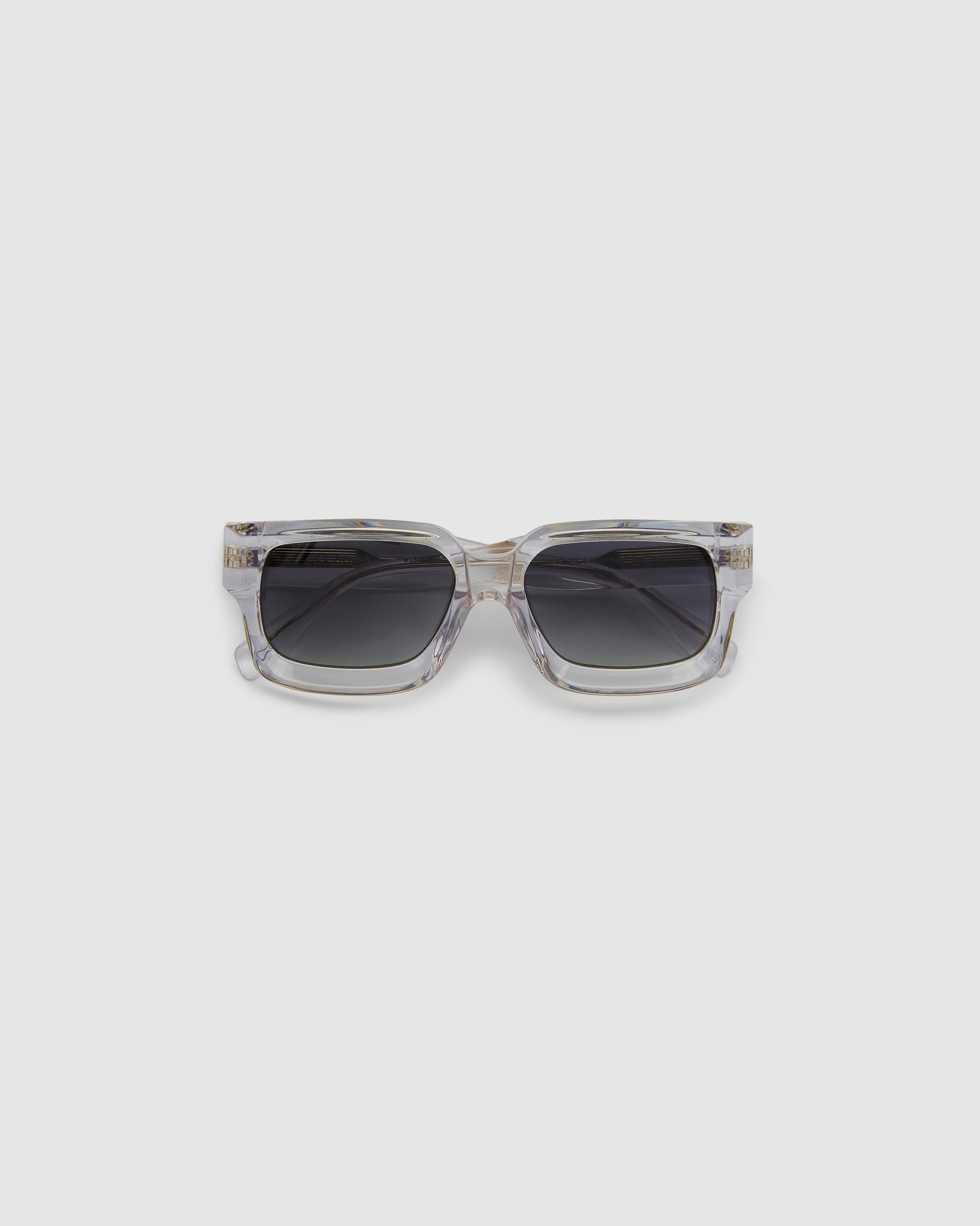 Brutal 3.0 Polarised Sunglasses by Tribu Eyewear — Crystal square acetate frame, flat view light grey background.