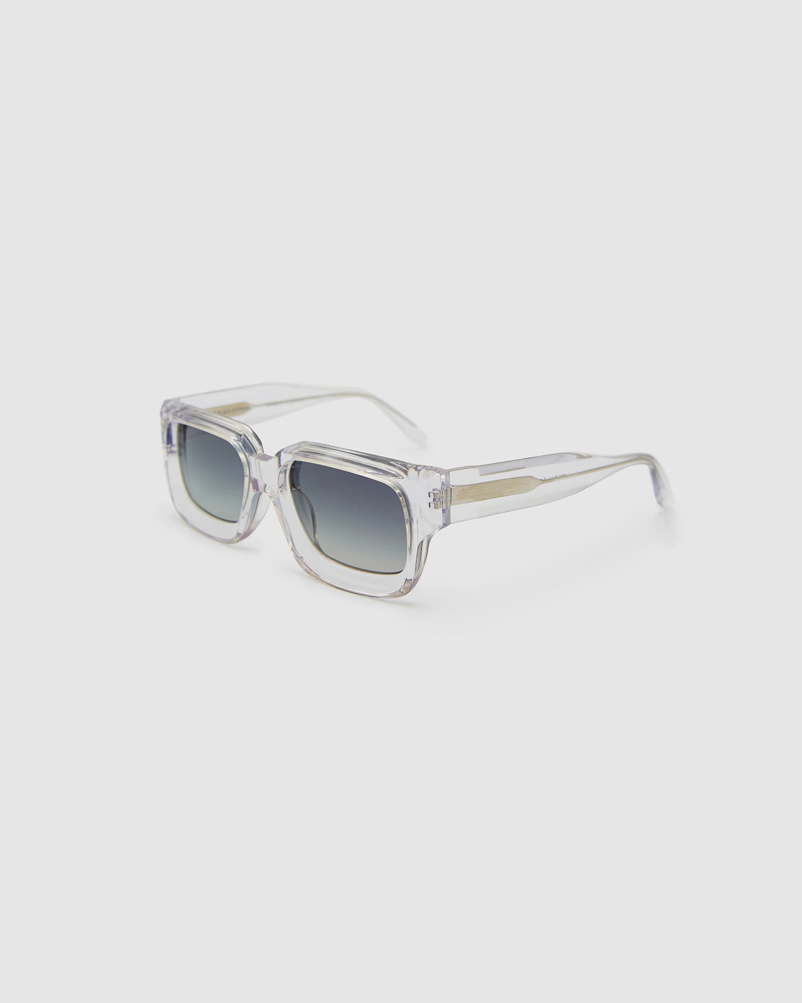 Brutal 3.0 Polarised Sunglasses by Tribu Eyewear — Crystal square acetate frame, side view light grey background.