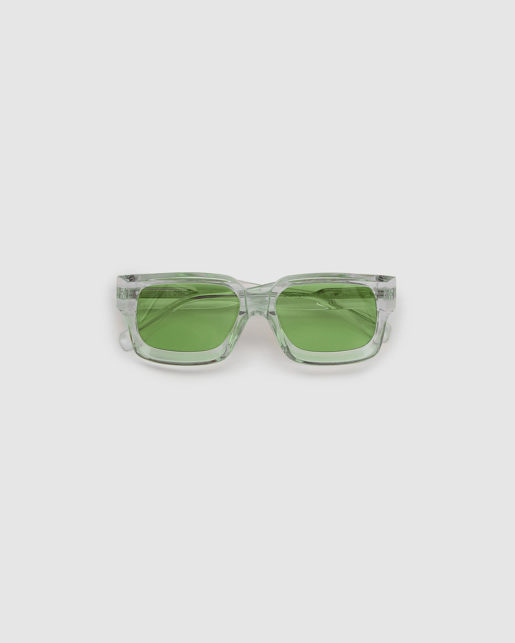 Brutal 3.0  Sunglasses by Tribu Eyewear — Crystal square acetate frame, sage lens, flat view light grey background.