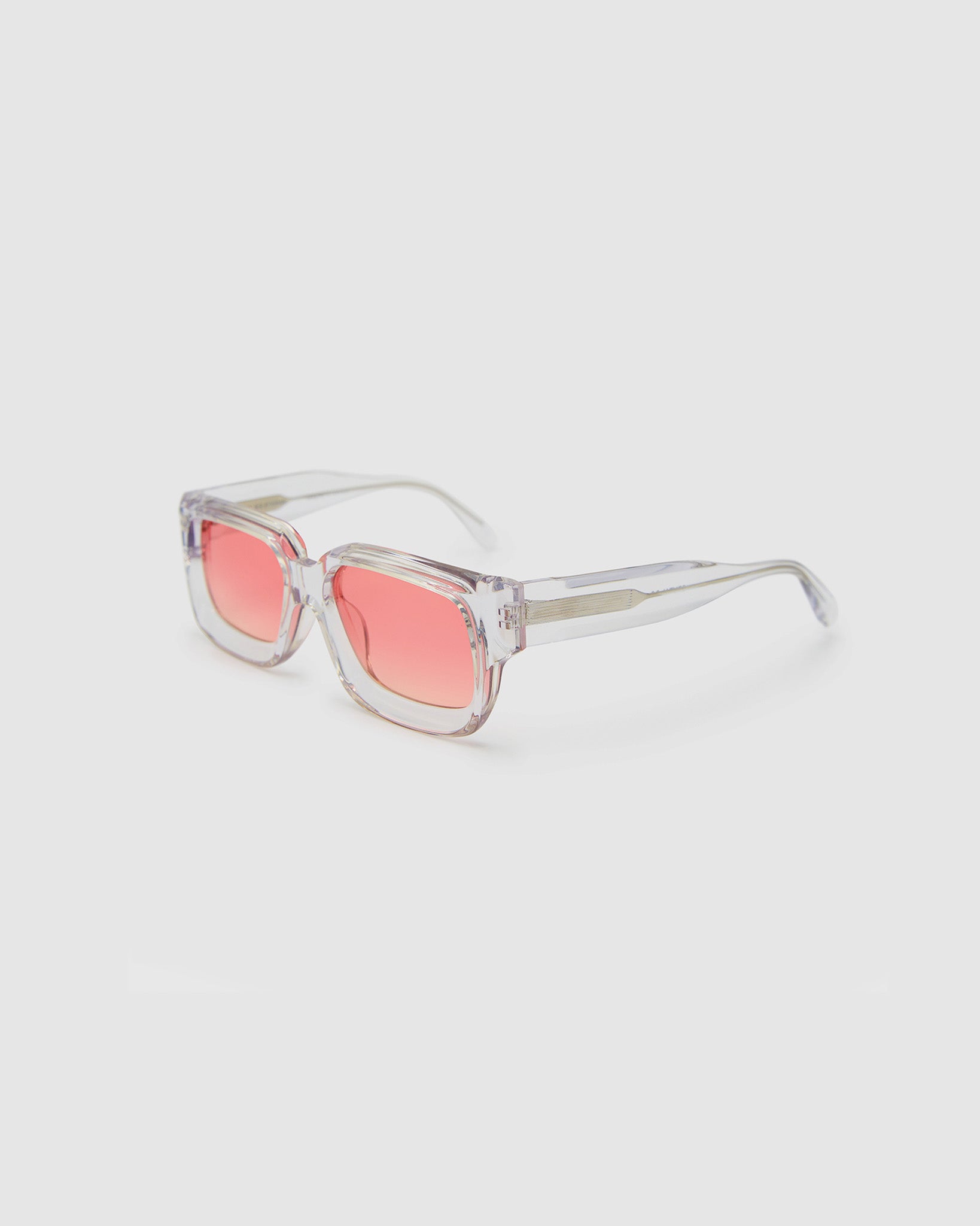 Brutal 3.0  Sunglasses by Tribu Eyewear — Crystal square acetate frame, sunset lens, side view light grey background.