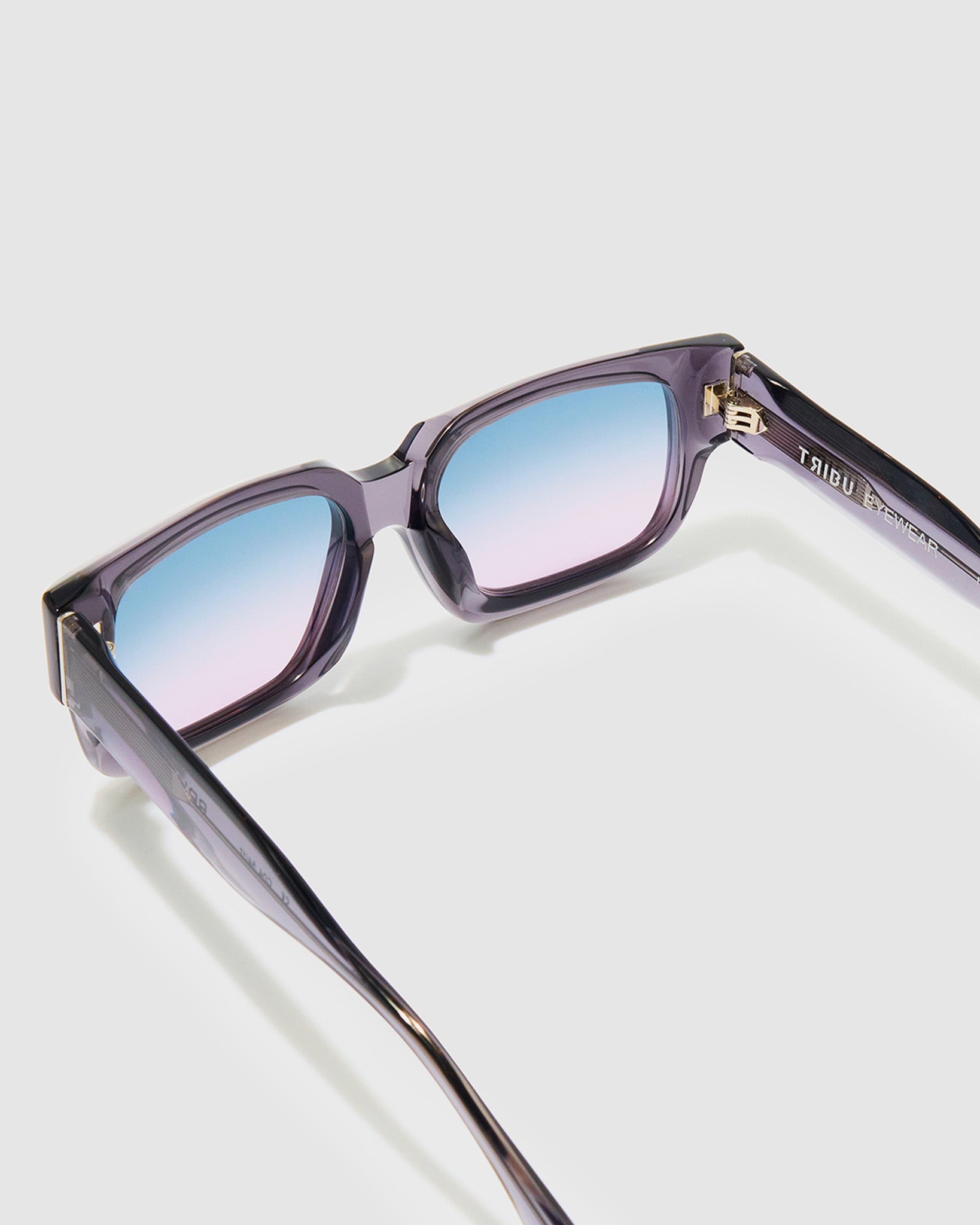 Brutal 3.0 Crystal Sunglasses by Tribu Eyewear — Smoke Crystal square acetate frame, Deep Ocean lens, detailed view light grey background.