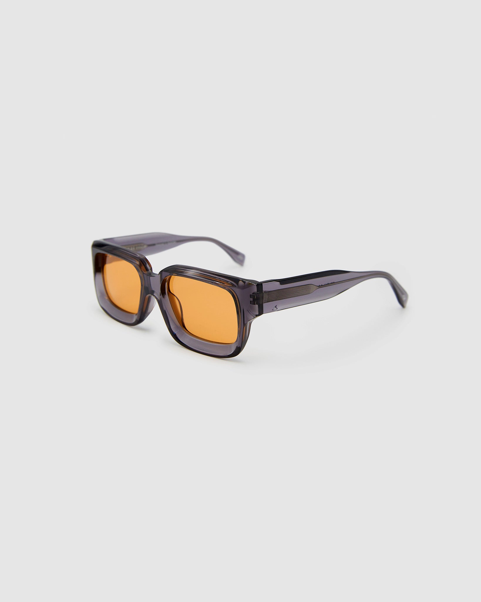 Brutal 3.0  Sunglasses by Tribu Eyewear — Smoke Crystal square acetate frame, desert orange lens, side view light grey background.