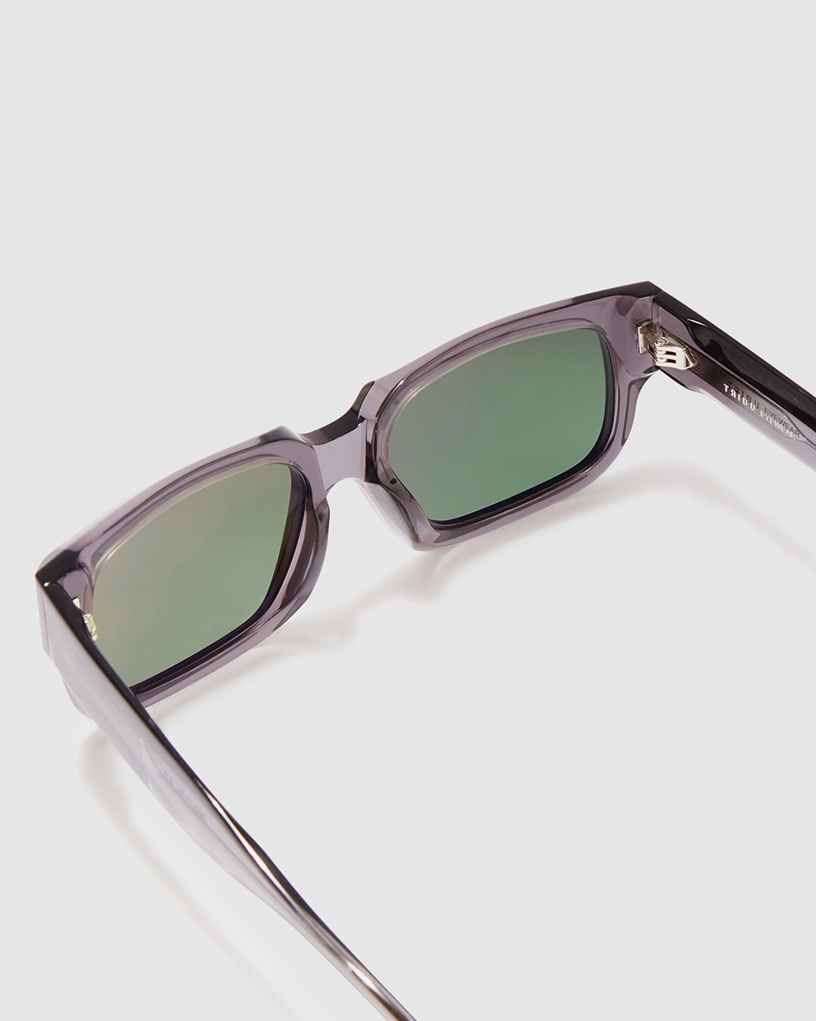 Brutal 3.0 Green Polarised Sunglasses by Tribu Eyewear — Smoke Crystal square acetate frame, detailed view light grey background.
