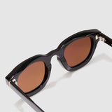 Brutal 4.0 Polarised Sunglasses by Tribu Eyewear — Black Round acetate frame, brown lens, detailed view light grey background.