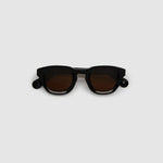 Brutal 4.0 Polarised Sunglasses by Tribu Eyewear — Black Round acetate frame, brown lens, flat view light grey background.