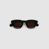 Brutal 4.0 Polarised Sunglasses by Tribu Eyewear — Black Round acetate frame, brown lens, flat view light grey background.
