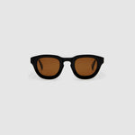 Brutal 4.0 Polarised Sunglasses by Tribu Eyewear — Black Round acetate frame, brown lens, front view light grey background.
