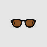 Brutal 4.0 Polarised Sunglasses by Tribu Eyewear — Black Round acetate frame, brown lens, front view light grey background.
