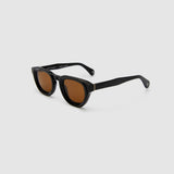 Brutal 4.0 Polarised Sunglasses by Tribu Eyewear — Black Round acetate frame, brown lens, side view light grey background.