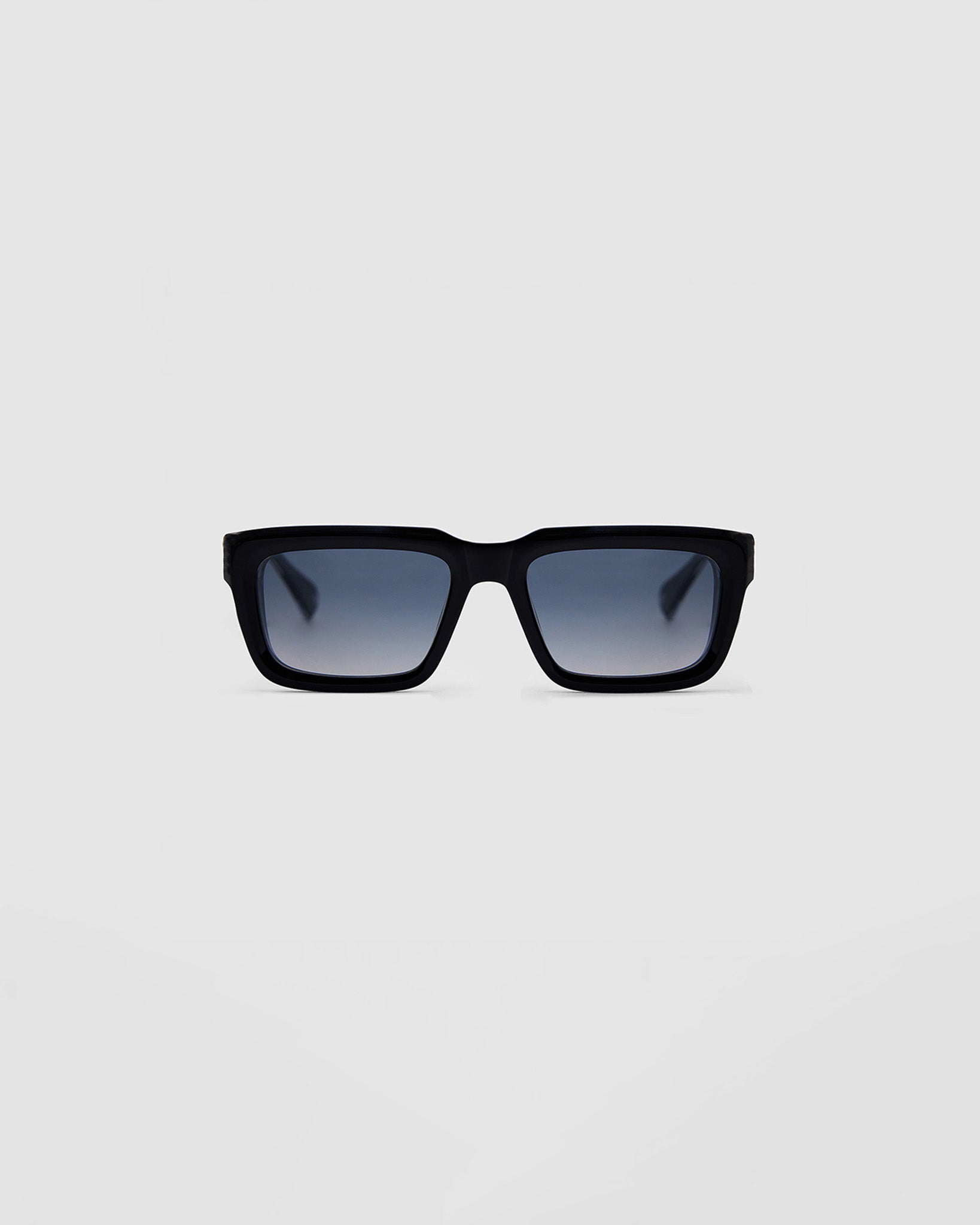 Brutal 5.0 Polarised Sunglasses by Tribu Eyewear — Black on Crystal rectangular acetate frame, grey lens, front view light grey background.