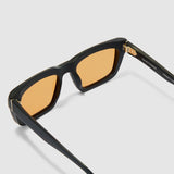 Brutal 5.0 Sunglasses by Tribu Eyewear — Matte black rectangular acetate frame, desert orange lens, detailed view  light grey background.