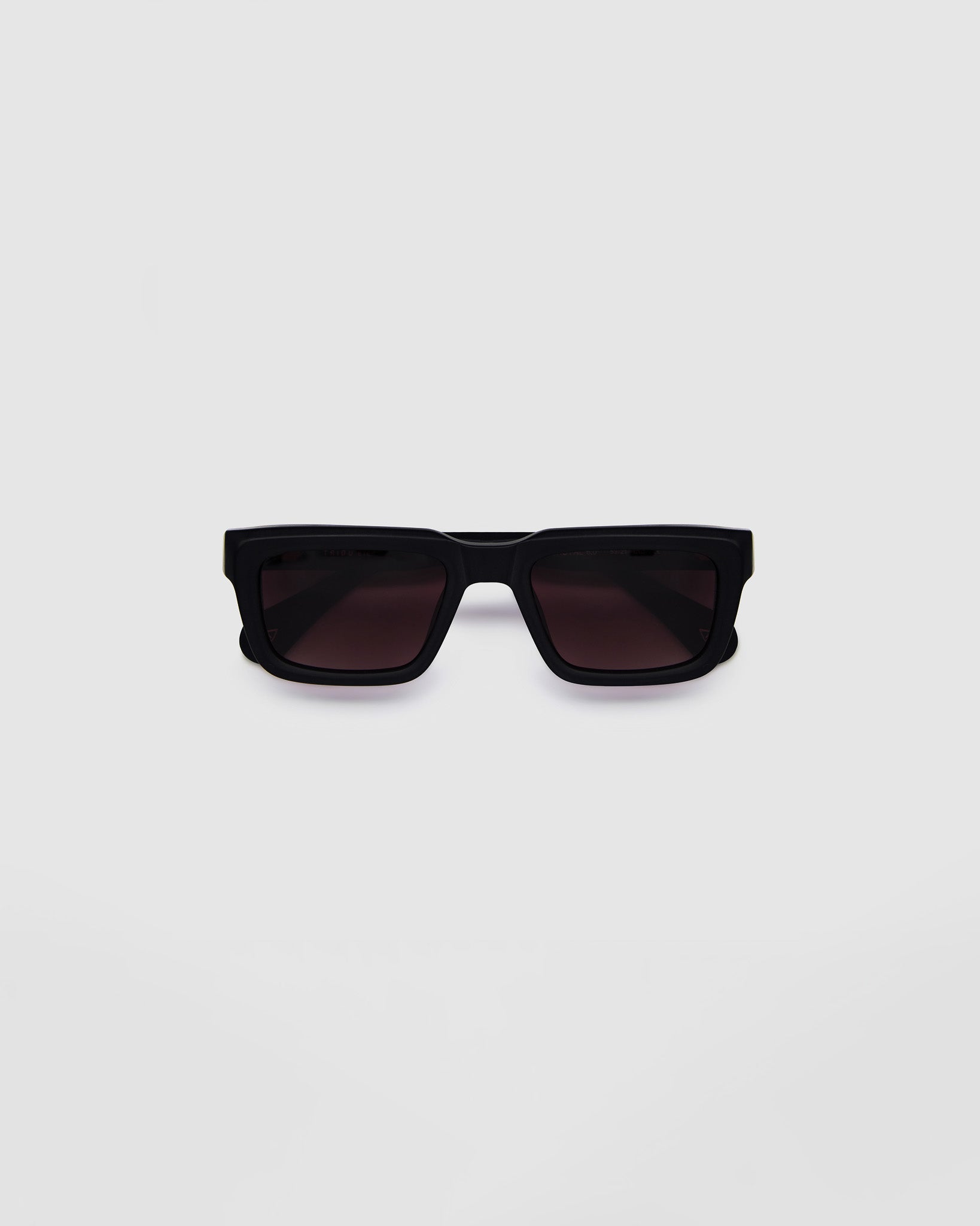 Brutal 5.0 Polarised Sunglasses by Tribu Eyewear — Matte Black rectangular acetate frame, rose grad lens, flat view light grey background.