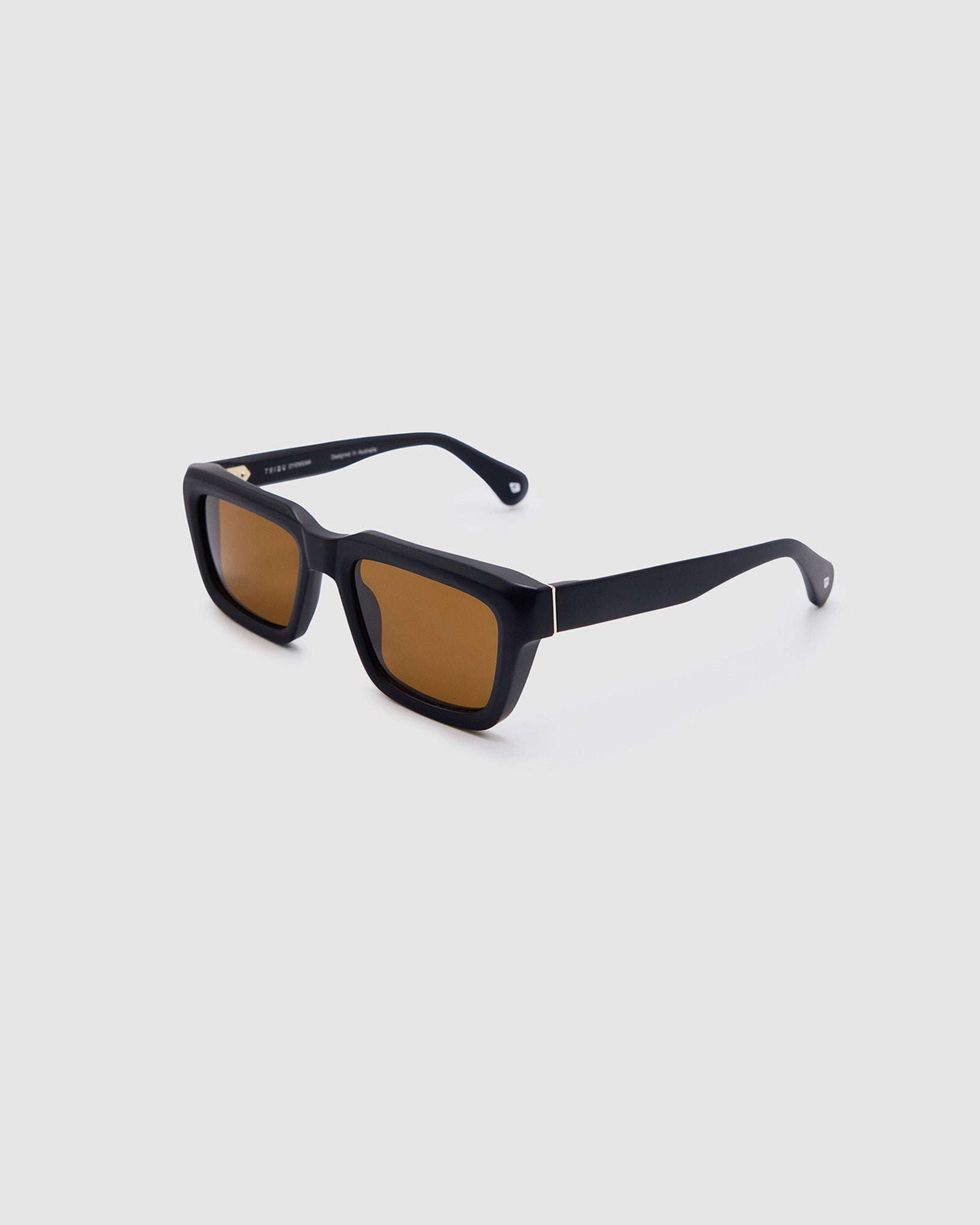 Brutal 5.0 Polarised Sunglasses by Tribu Eyewear — Matte Black rectangular acetate frame, brown lens, side view light grey background.