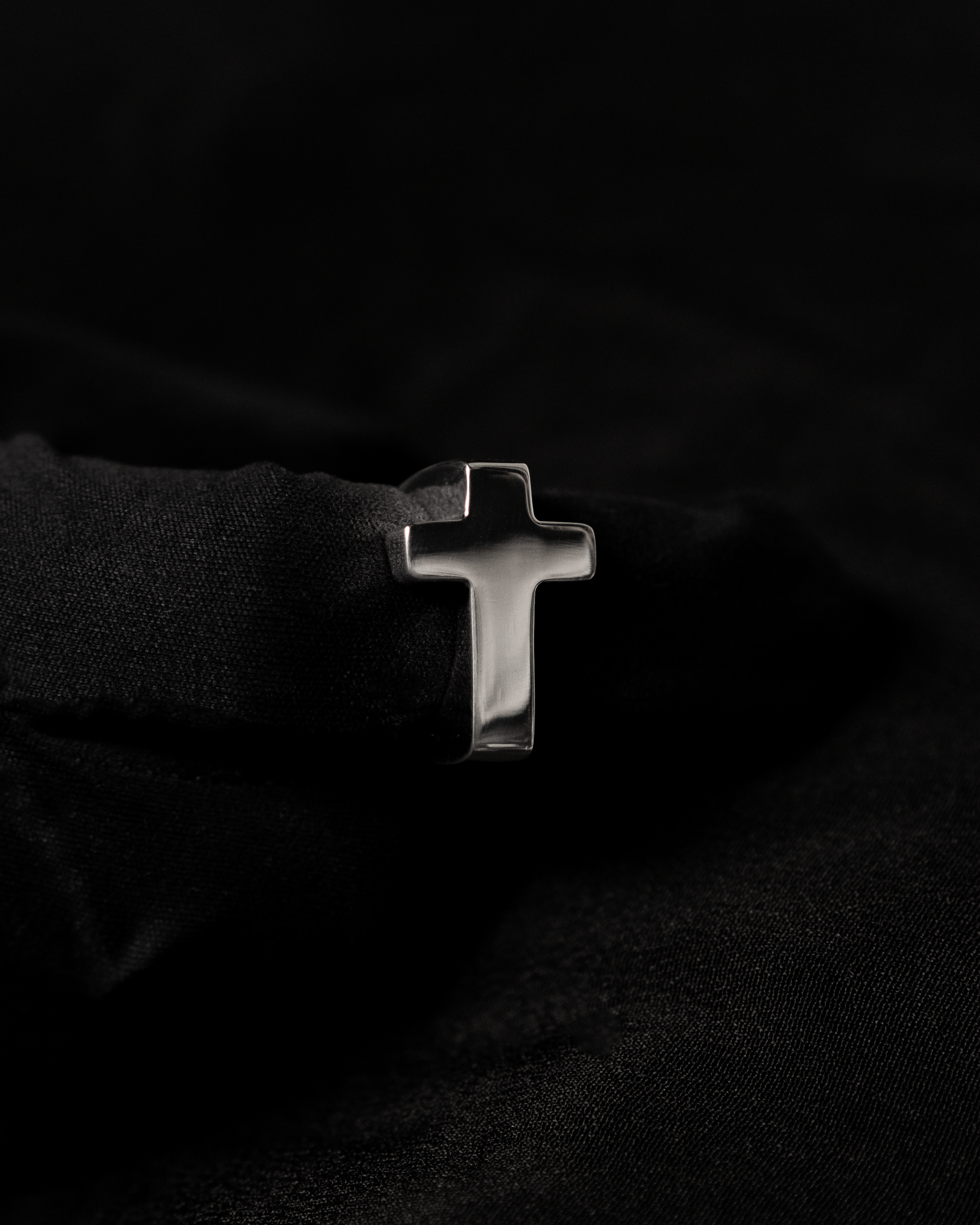 Cross Ring TRIBU — Sterling Silver, front view on black background.