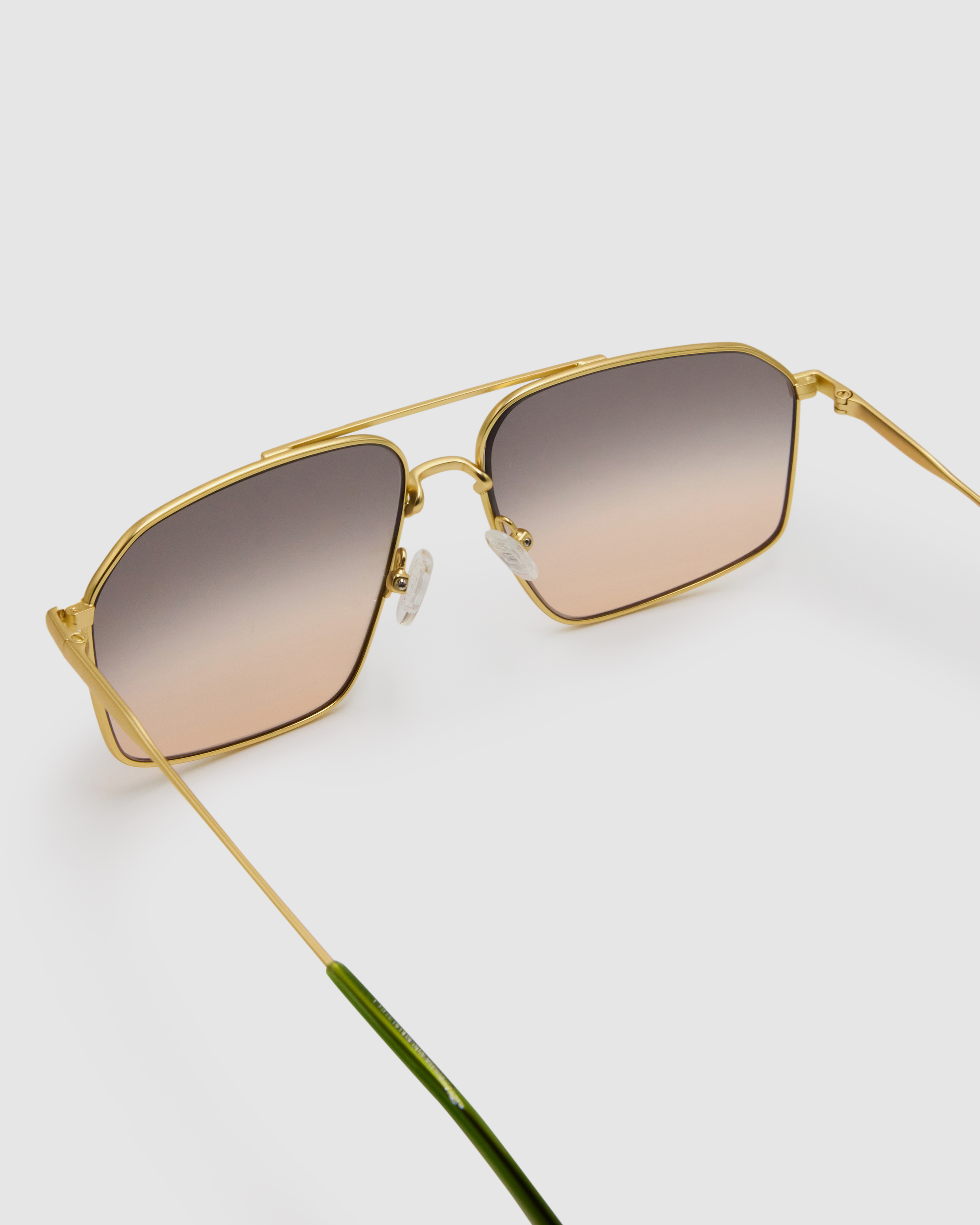 Fonda Gold Sunglasses by Tribu Eyewear  — Fine wire metal aviator frame, dusk tint detailed view on white background. 