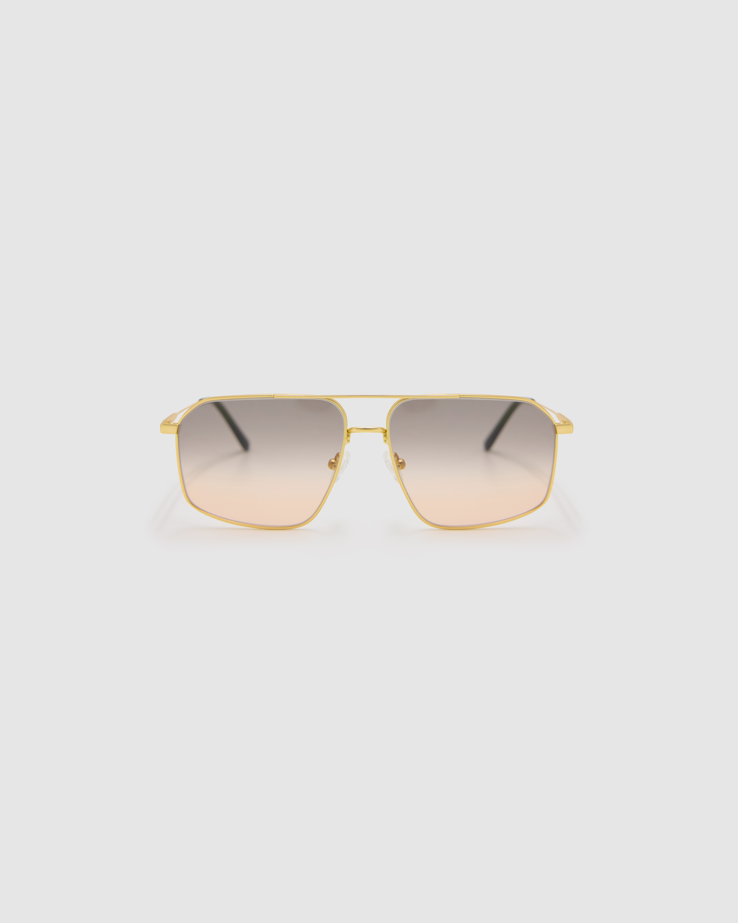 Fonda Gold Sunglasses by Tribu Eyewear  — Fine wire metal aviator frame, dusk tint lens front view on white background. 