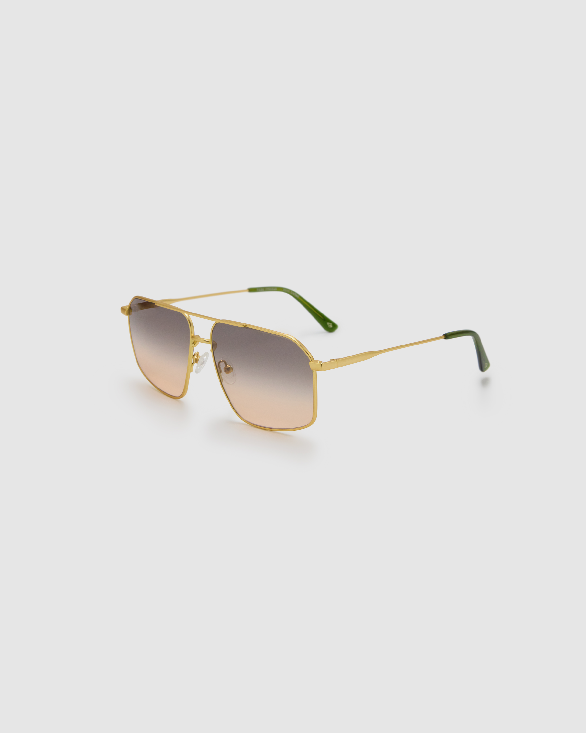 Fonda Gold Sunglasses by Tribu Eyewear  — Fine wire metal aviator frame, dusk tint lens side view on white background. 