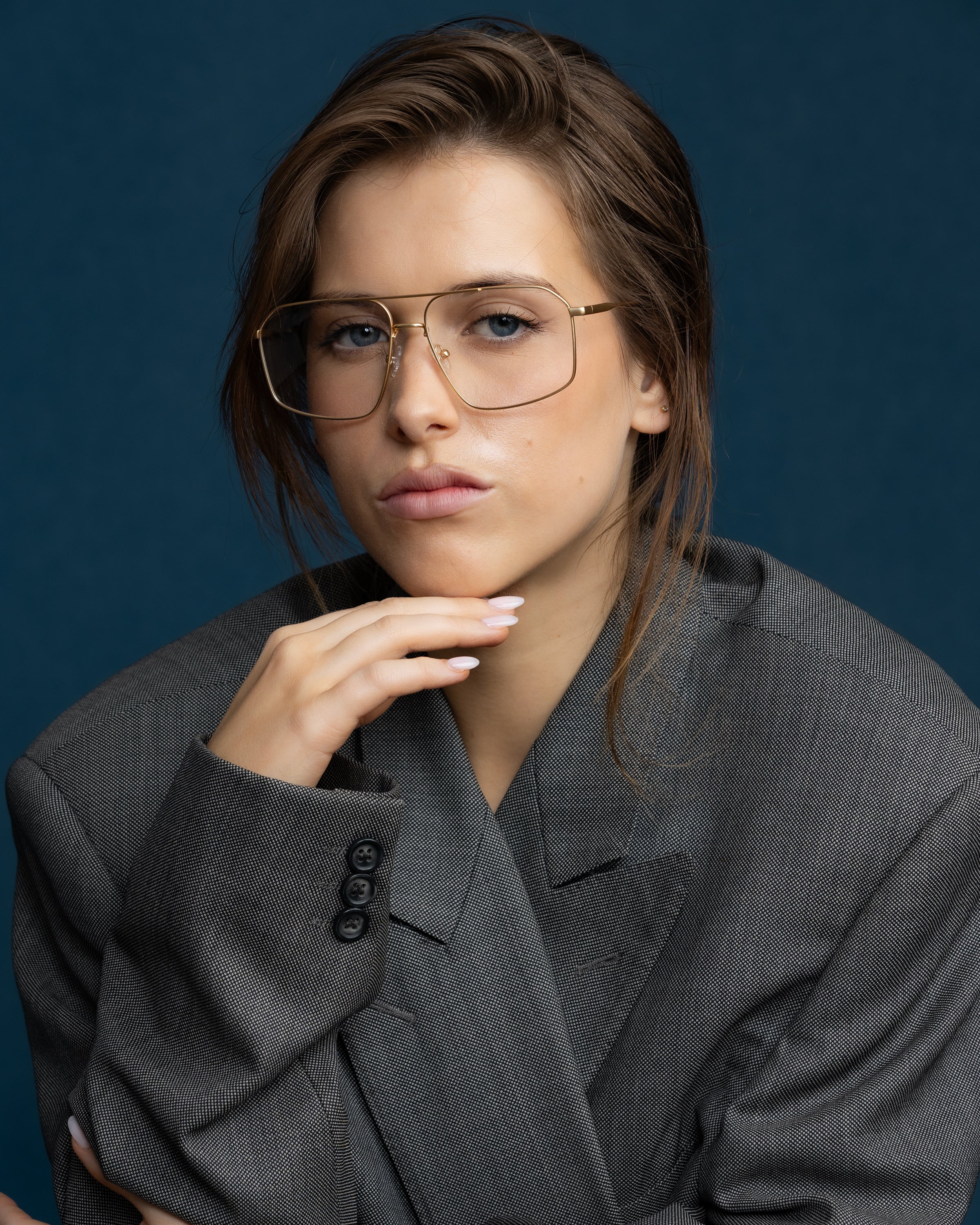 Fonda Brushed Gold Optical by Tribu Eyewear — Fine wire metal frame, on face studio view.