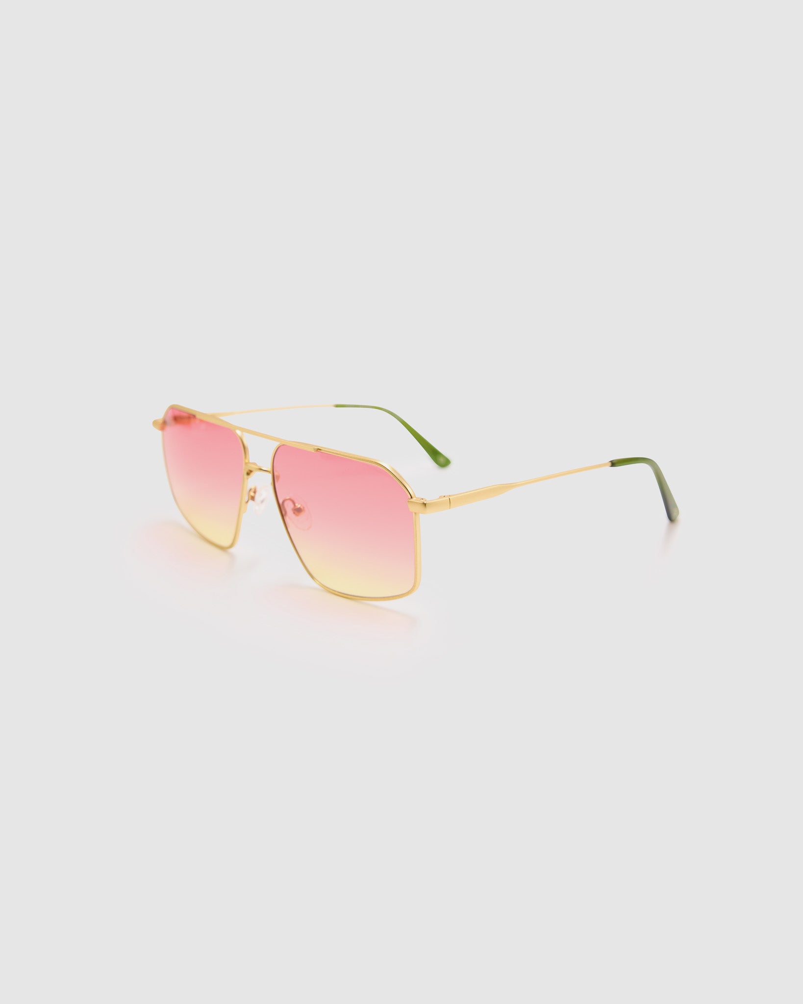 Fonda Gold Sunglasses by Tribu Eyewear  — Fine wire metal aviator frame, sunset tint lens, side view on white background. 