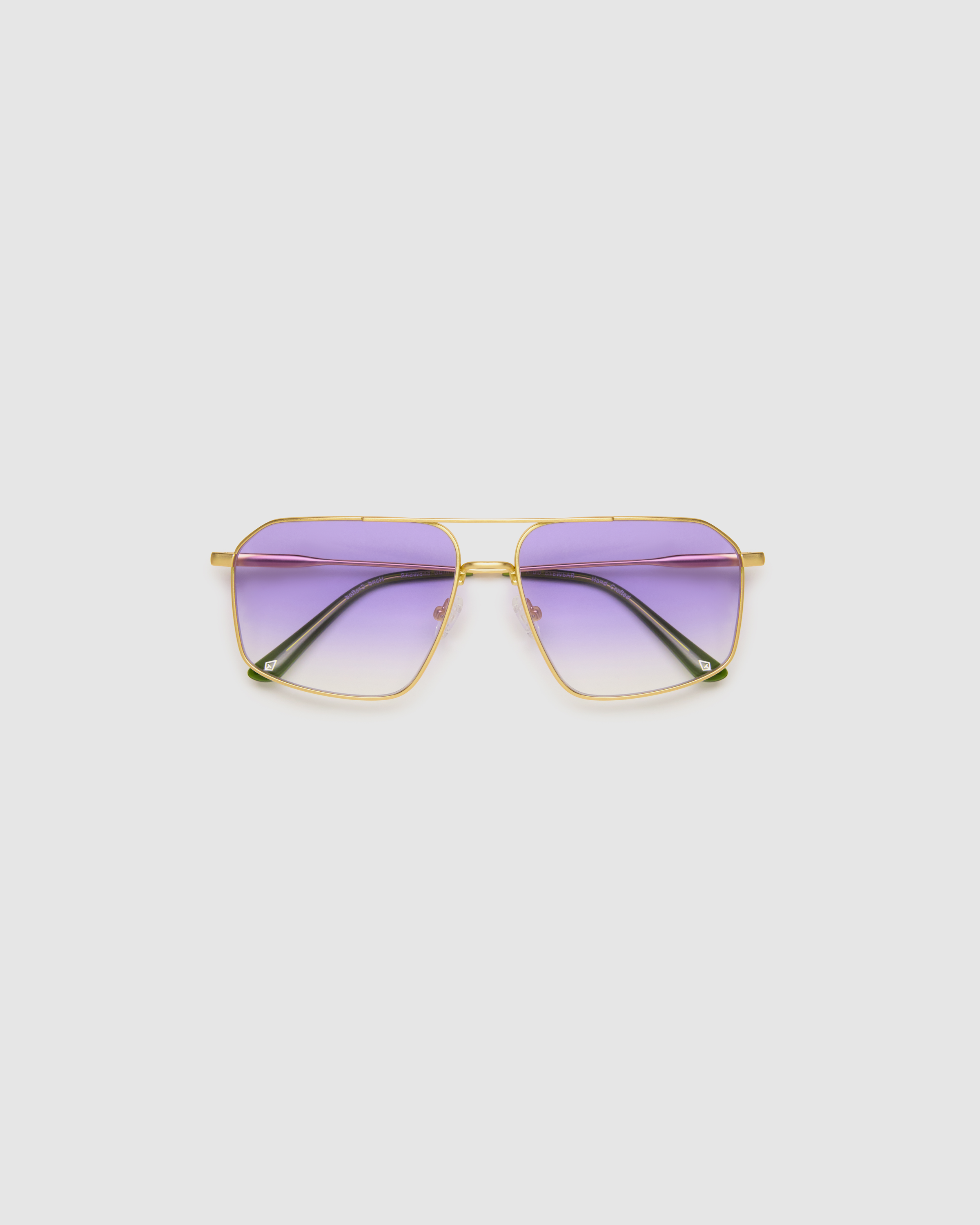 Fonda Gold Sunglasses by Tribu Eyewear  — Fine wire metal aviator frame, virgin violet lens, flat view on white background. 