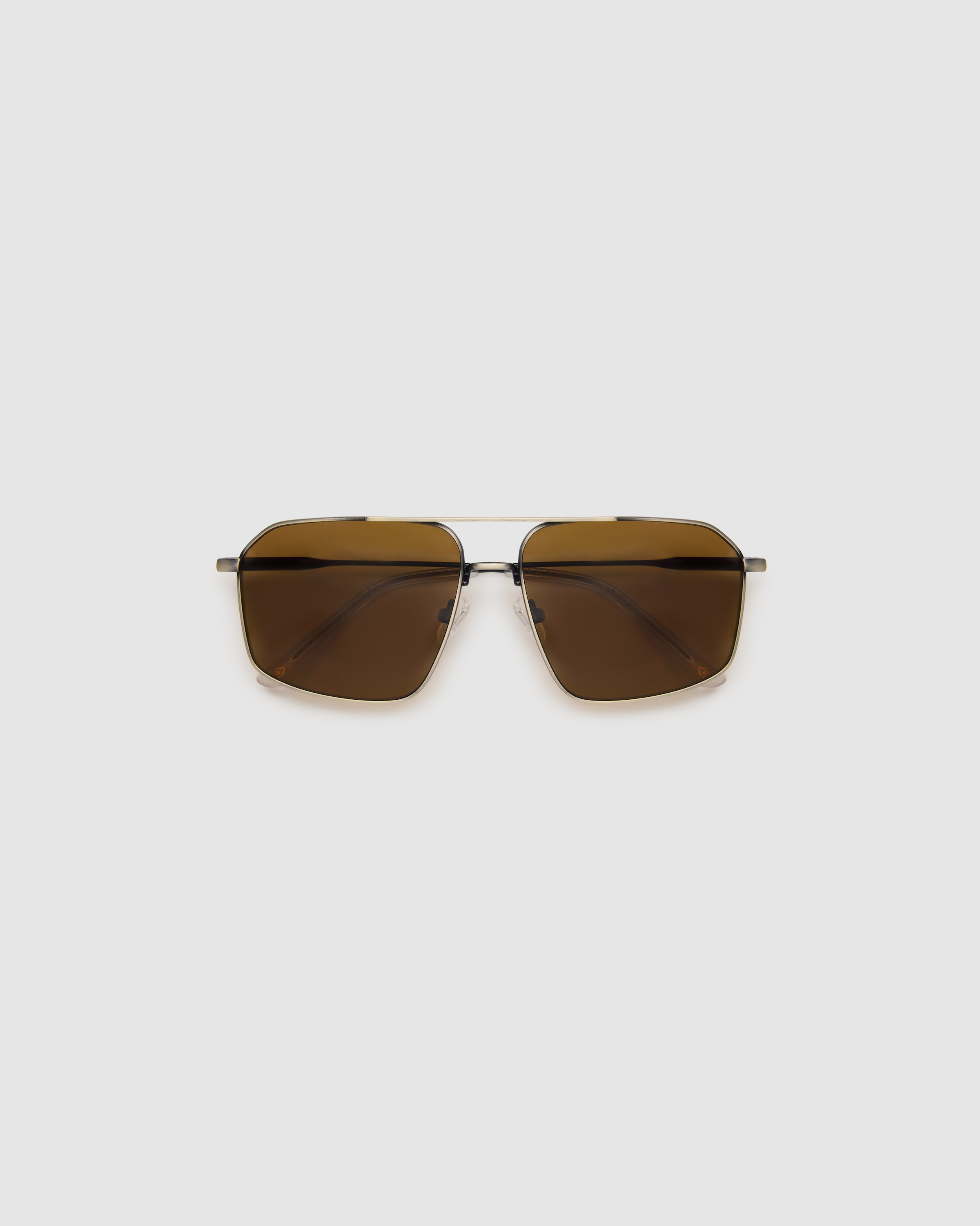 Fonda Sunglasses by Tribu Eyewear — Brown polarised lens in a gun metal aviator frame, flat view on a grey background.