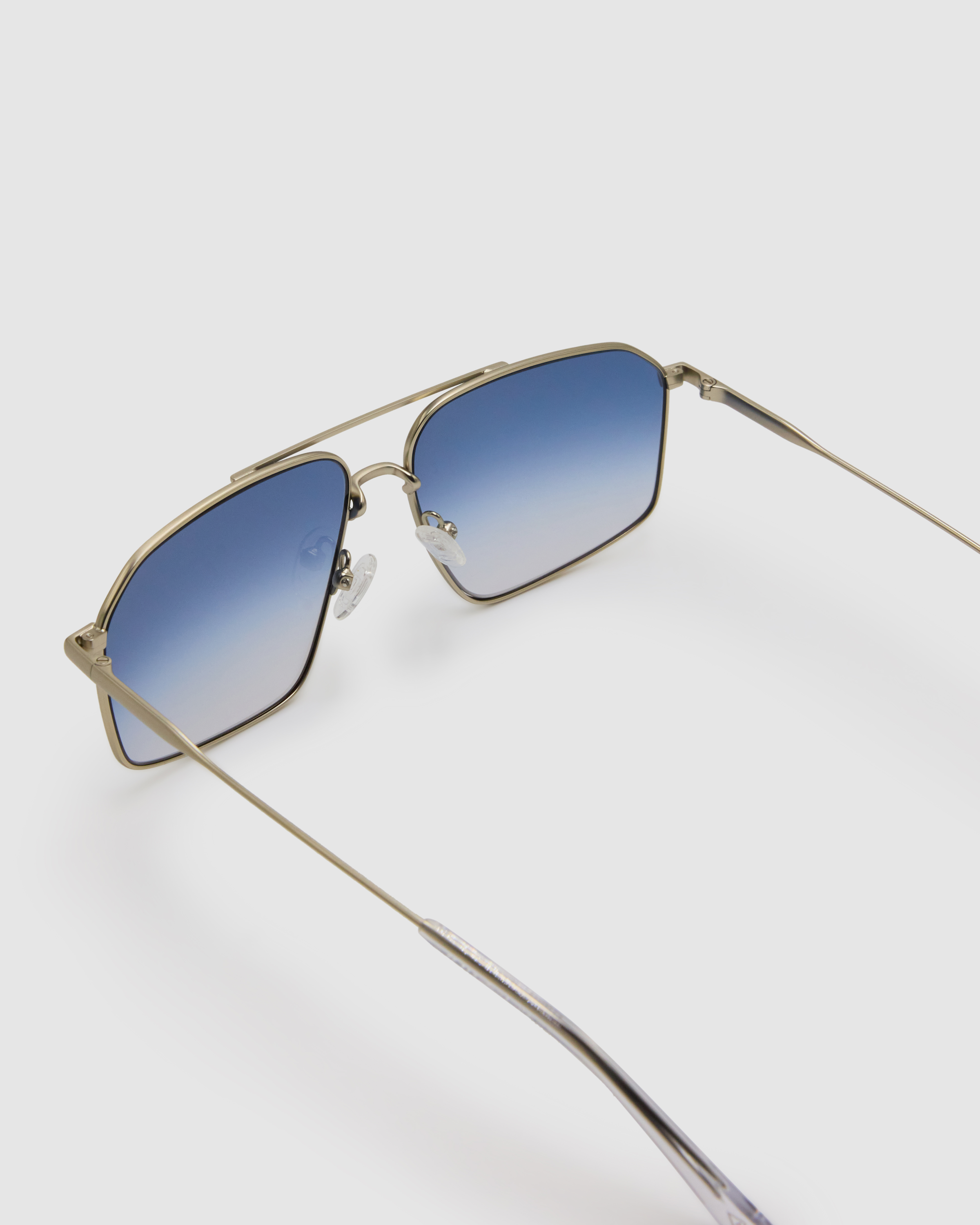 Fonda Silver Sunglasses by Tribu Eyewear  — Fine wire metal aviator frame, blue sky lens, detailed view on white background.