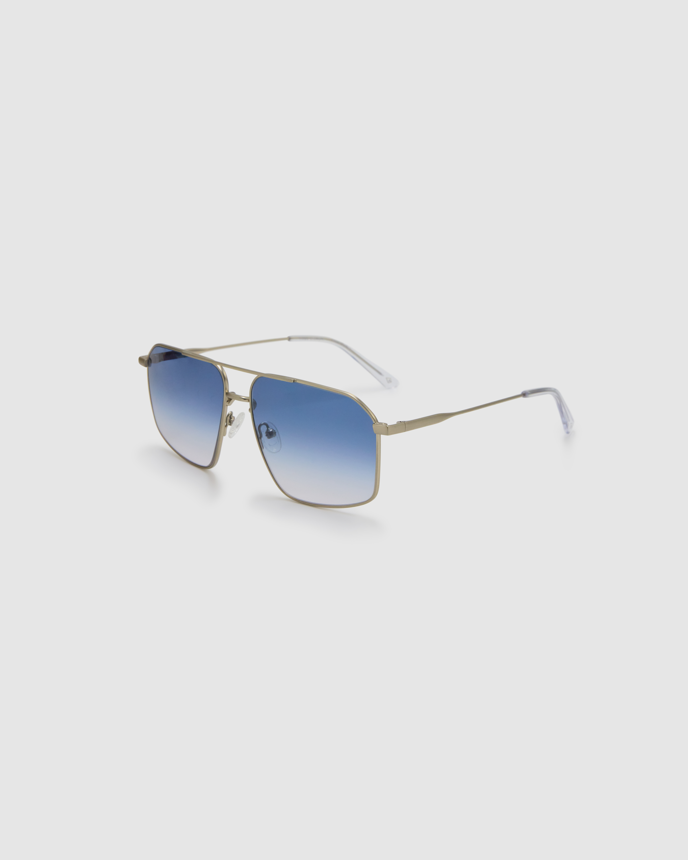 Fonda Silver Sunglasses by Tribu Eyewear  — Fine wire metal aviator frame, blue sky lens, side view on white background.