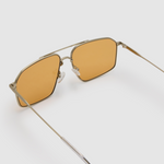 Fonda Silver Sunglasses by Tribu Eyewear  — Fine wire metal aviator frame, desert orange lens, detailed view on white background.