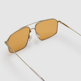 Fonda Silver Sunglasses by Tribu Eyewear  — Fine wire metal aviator frame, desert orange lens, detailed view on white background.