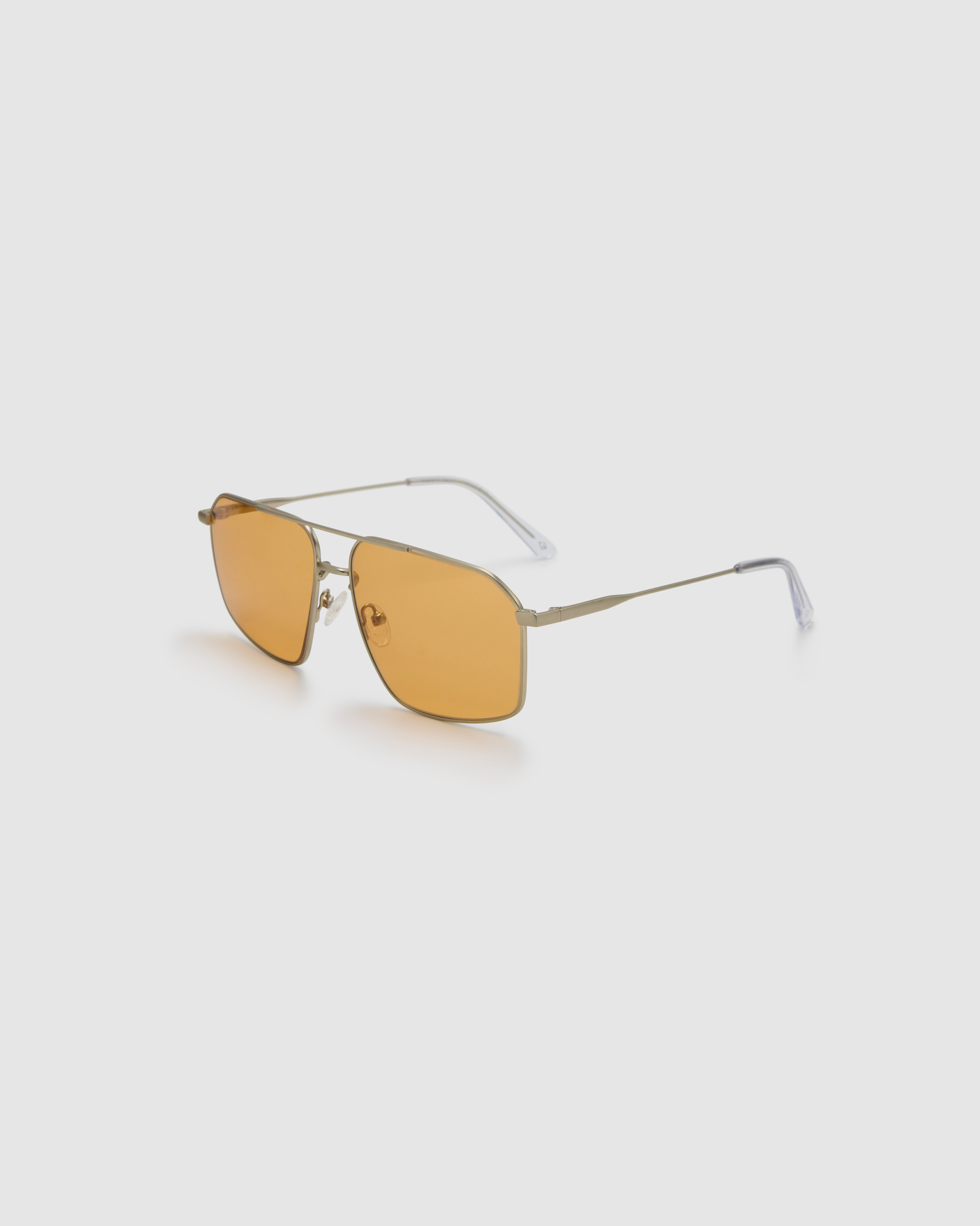 Fonda Silver Sunglasses by Tribu Eyewear  — Fine wire metal aviator frame, desert orange lens, side view on white background.